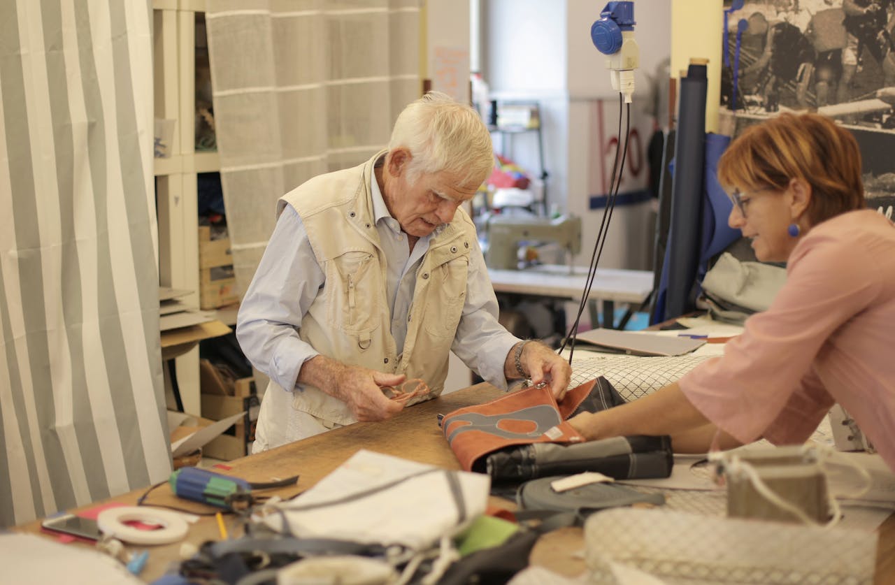 One Old man and client in a leathers factory